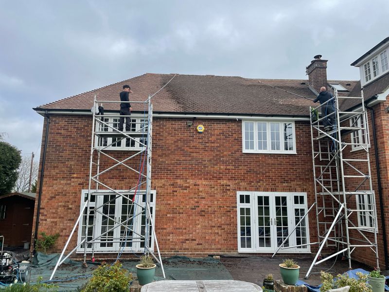Roof cleaning carried out safely from scaffold towers by The Roof Moss Cleaners in Basingstoke